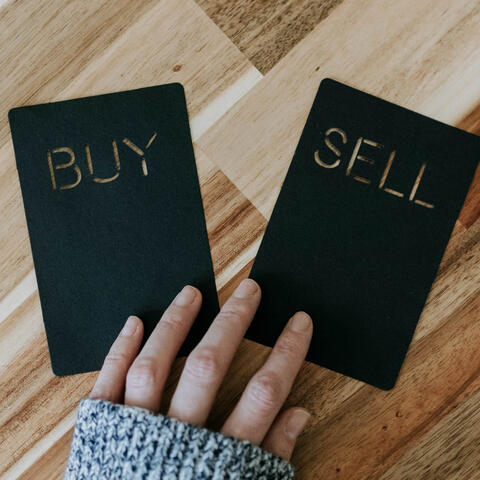 Buy and Sell cards representing futures trading decisions